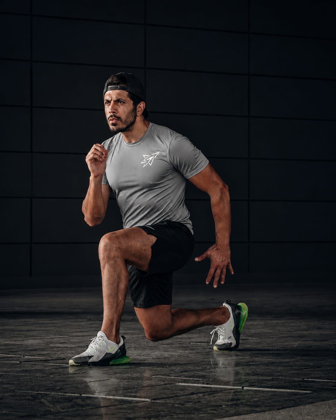 Athlete mid-stride in a custom Black Shark training tee